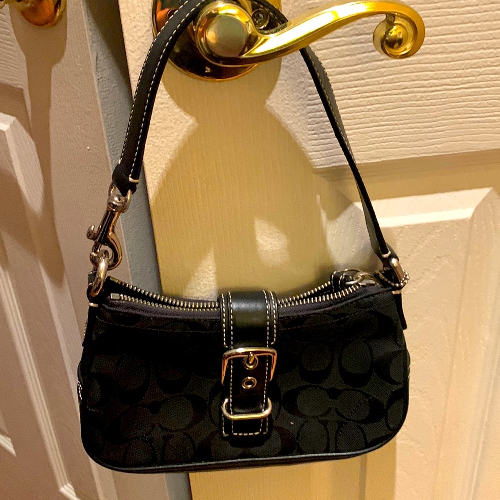 Coach bag. Black with “C” logo all over. Leather strap and leather bottom